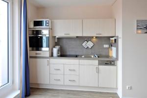 Apartment 37 "Sonnendeck", Blickrichtung von der Terrasse auf das Offenes Meer, Strand, Innenstadt