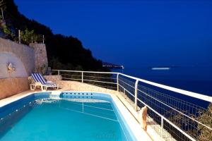Unique Dalmatian Seafront Villa -in a 300 m2 Mediterranean garden with private beach, large pool and terrace.
