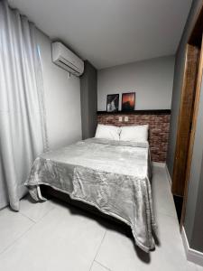 Loft Confortável com Ar, Cozinha e Wi-Fi no Centro