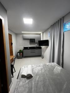 Loft Confortável com Ar, Cozinha e Wi-Fi no Centro