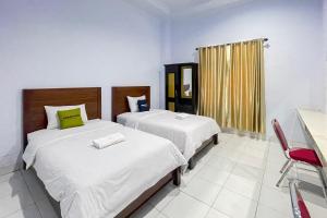 Urbanview Hotel Grand Seven One Kota