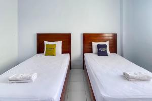 Urbanview Hotel Grand Seven One Kota