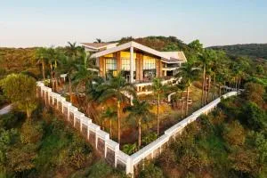 StayVista's Emerald Acres offering a heated pool, bonfire, snooker table, scenic views, tennis court, steam room, gazebo, & gym - Āmbavna