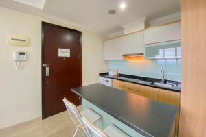 Spacious and Comfort Living 2BR at Menteng Park Apartment By Travelio
