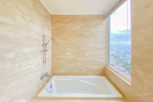 Spacious and Comfort Living 2BR at Menteng Park Apartment By Travelio