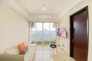 Spacious and Comfort Living 2BR at Menteng Park Apartment By Travelio