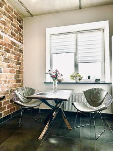 Modern apartments with a coffee machine in the city center, a view of the city