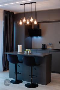 2 Level 1 Bedroom Lux Apartment with Balcony 75 Inch TV and Sofa Bed near Promenada Mall with High Ceilings Kitchen Washer and Work Space