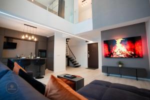 2 Level 1 Bedroom Lux Apartment with Balcony 75 Inch TV and Sofa Bed near Promenada Mall with High Ceilings Kitchen Washer and Work Space