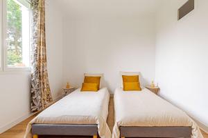 Appartements Le Paul - Gare - Calme - Jardin : photos des chambres