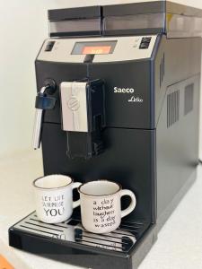 Apartments with a coffee machine in the city center, near a park and Zlata Plaza