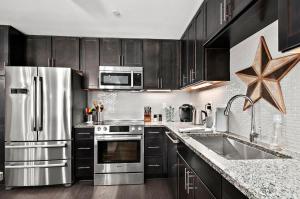 2BR Condo with Balcony, Free Tix, Walk to Downtown