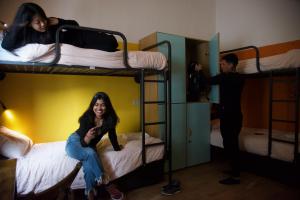 Bed in 6-Bed Mixed Dormitory Room with Private Bathroom room in Sunflower City Youth Hotel