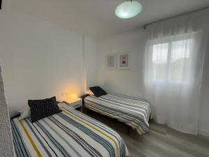 Stylish & sunny beach apartment with pool