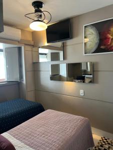 Flat sensacional 5 pessoas em condomínio moderno 2 suites climatizados