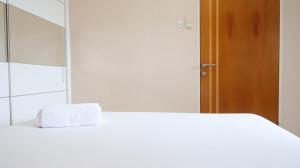 Homey 2BR at Puncak Bukit Golf Surabaya Apartment By Travelio