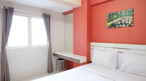 Homey 2BR at Puncak Bukit Golf Surabaya Apartment By Travelio