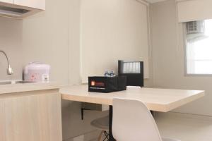 Cozy Studio at Gateway Park LRT City Jatibening Apartment By Travelio
