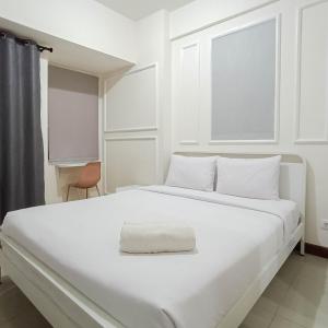 White and Cozy Studio at Vida View Makassar Apartment By Travelio - 3hvězdičkové hotely ve městě Pampang
