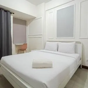 White and Cozy Studio at Vida View Makassar Apartment By Travelio - Pampang