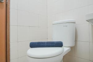 Cozy Living 1BR at Tifolia Apartment By Travelio