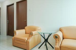 Cozy Living 1BR at Tifolia Apartment By Travelio