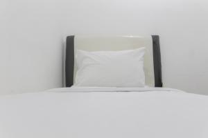 Minimalist and Enjoy 2BR at Bassura Apartment near Bassura Mall By Travelio