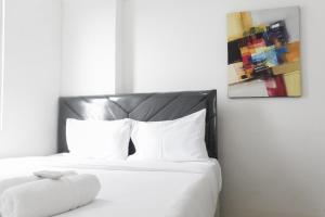 Minimalist and Enjoy 2BR at Bassura Apartment near Bassura Mall By Travelio