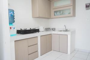 Comfort and Cozy 1BR at Casa De Parco Apartment By Travelio