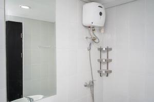 Comfort and Cozy 1BR at Casa De Parco Apartment By Travelio