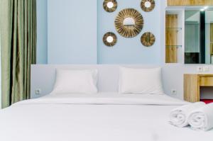 Nice and Comfort 1BR at The Smith Alam Sutera Apartment By Travelio