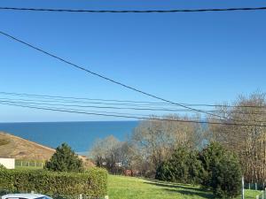 Maisons de vacances Saint Ho Mer Maison lumineuse vue mer 8 pers 4 chambres 2 sdb 2 WC etage renove en 2025 belle terrasse grand jardin clos parking 8 mn a pied petite plage grand jardin pres de Port en Bessin, Bayeux et plage Omaha beach : photos des chambres