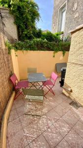 Appartements La maison aux volets bleus : photos des chambres