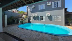 Casa Iguassu - Casa com churrasqueira e piscina em Foz do Iguaçu - Pousada de lazer para família e amigos - Vily, Foz do Iguaçu