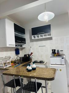 Studio aconchego em itapõa - ar cond e perto da praia