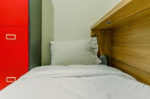 Elegant and Tidy 2BR Green Pramuka City Apartment near Mall By Travelio