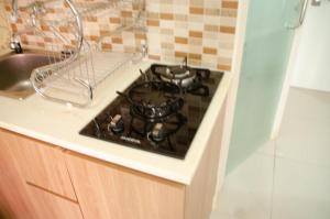 Elegant and Tidy 2BR Green Pramuka City Apartment near Mall By Travelio