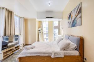 Minimalist Haven 3BR unit at Mckinley Hill