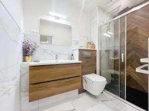 Appartements V- Appart SPA Moderne-Chic : photos des chambres