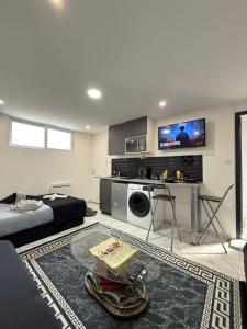 Appartements SUPERBE STUDIO PROCHE PARIs : photos des chambres