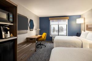 Standard Queen Room with Two Queen Beds and Mobility Accessible Tub room in Holiday Inn Express Syracuse Airport an IHG Hotel