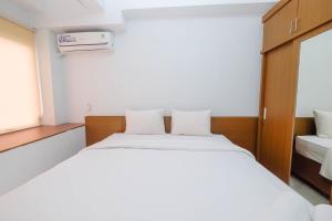 Comfort Studio Apartment at Patraland Urbano By Travelio