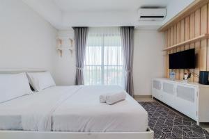 Comfort 1BR without Living Room Bintaro Embarcadero Apartment By Travelio