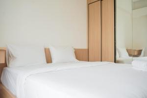 Fully Furnished with Cozy Design 2BR at Sky House BSD Apartment By Travelio