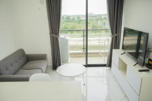 Fully Furnished with Cozy Design 2BR at Sky House BSD Apartment By Travelio