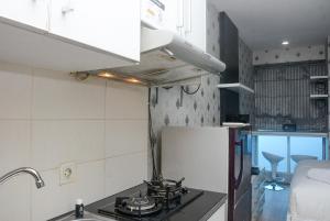 Comfort with City View Studio Tifolia Apartment By Travelio