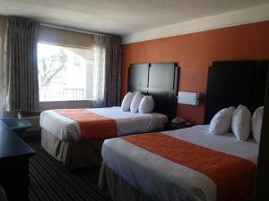 Double Room with Two Double Beds - Non-Smoking room in Howard Johnson by Wyndham Historic Lake Charles