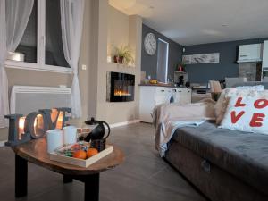 Lalcôve du 510 - Spa - chambre romantique - sauna - salle de jeux