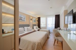 Standard Triple Room with Side Sea View room in Porto Bello Hotel Resort & Spa