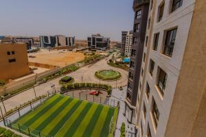 Porto New Cairo - Nyoum compound Modern 2-Bedroom, Prime Location